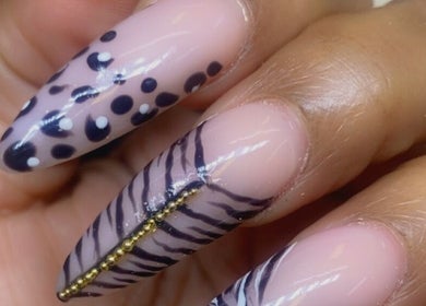 Elegant nail art with polka dots and stripes by Alluring Nails by Tammy, New Providence, BS.