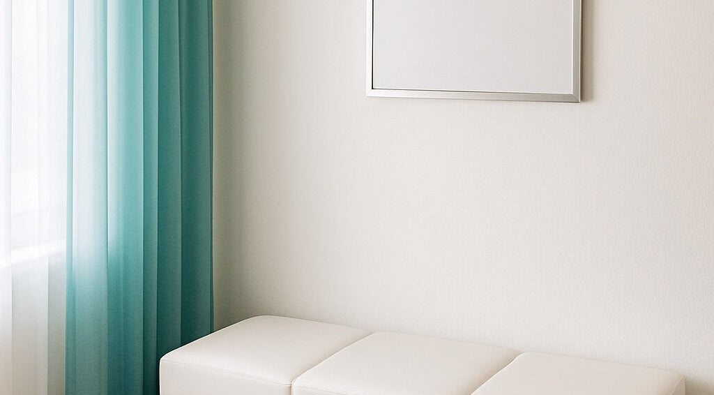 Elegant waiting area at Alluring Nails by Tammy in New Providence, BS, with teal curtains and a white bench.