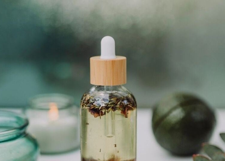 Herbal oil bottle at Illumine Skin and Wholeness Spa, Longmont, Colorado, US, embodies natural wellness and calm.