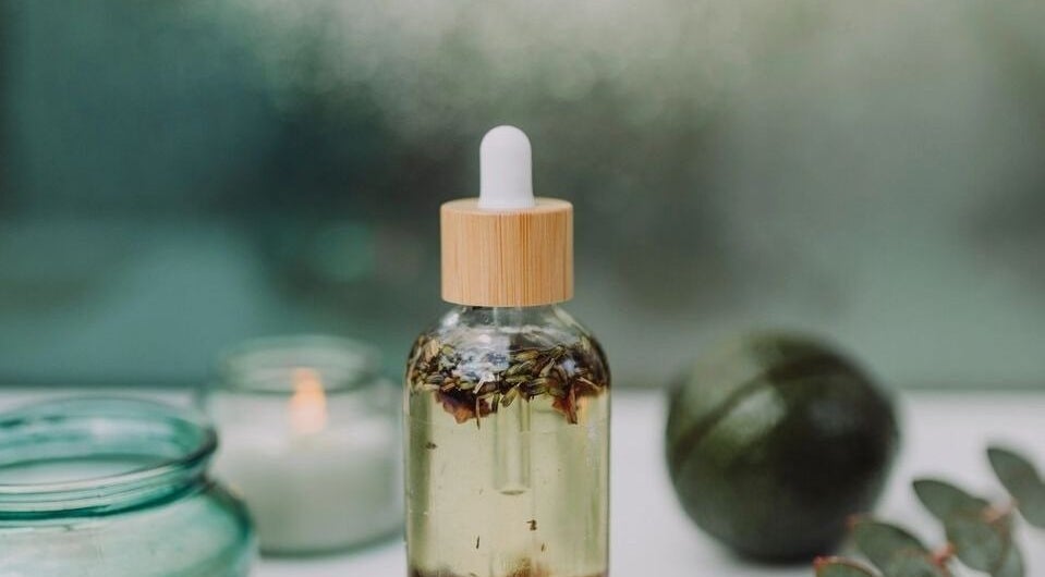 Herbal oil bottle at Illumine Skin and Wholeness Spa, Longmont, Colorado, US, embodies natural wellness and calm.