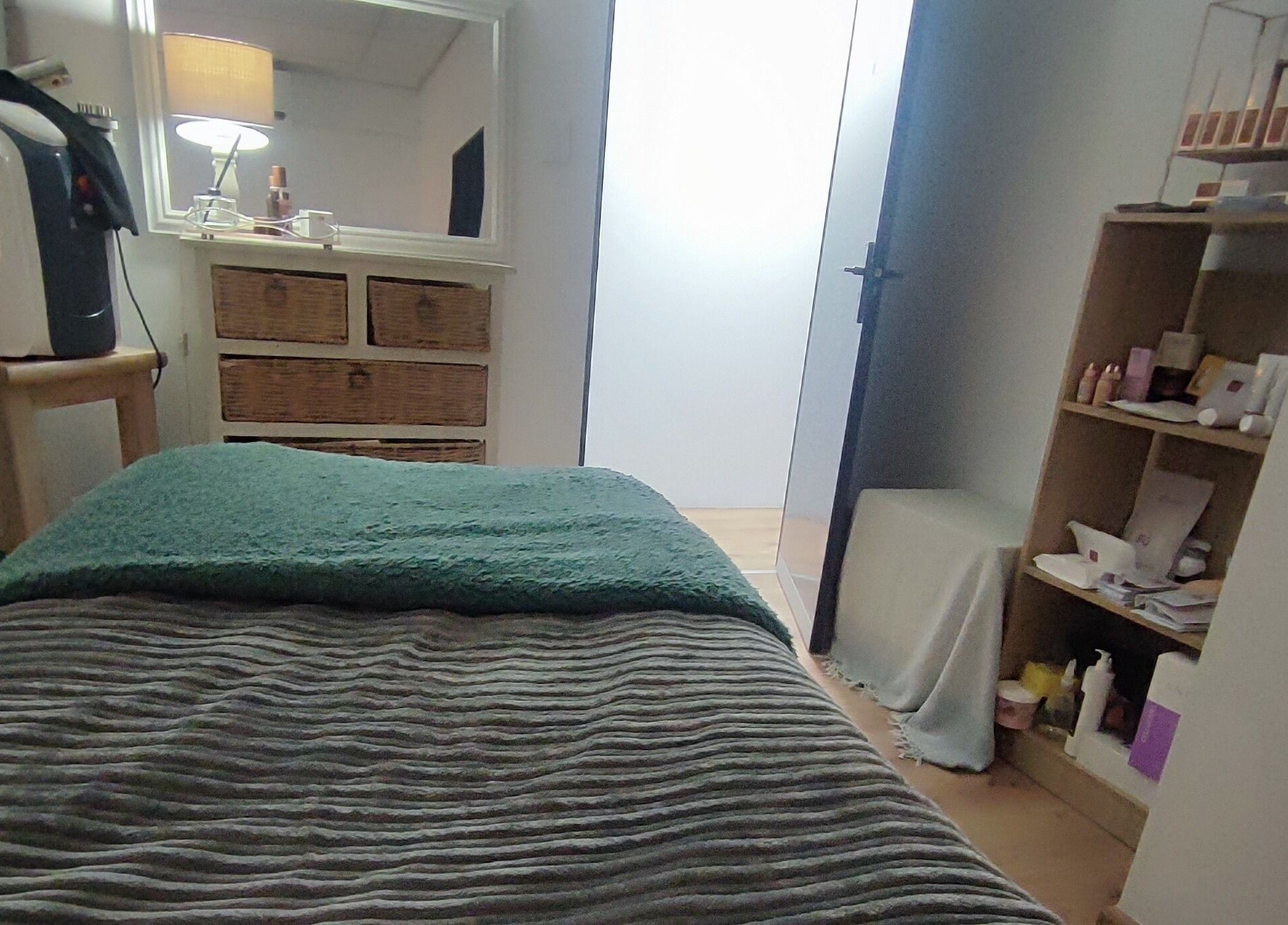 Relaxing therapy room at Skin and Body Wellness Gordons Bay, Cape Town, Western Cape, ZA, offering comfort.