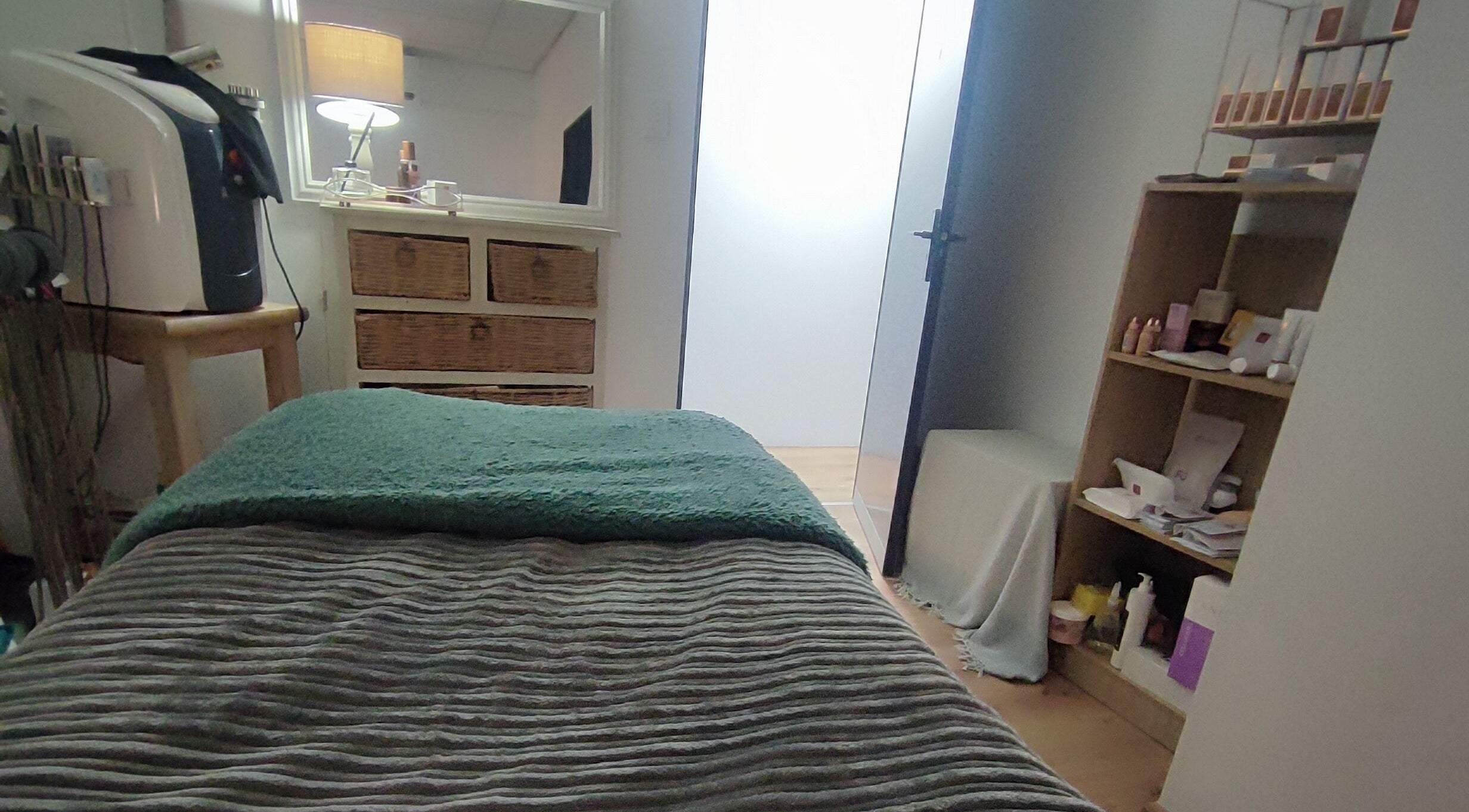 Relaxing therapy room at Skin and Body Wellness Gordons Bay, Cape Town, Western Cape, ZA, offering comfort.