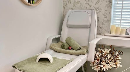 Relaxing nail salon chair at Kate Matthews Master Nail Artist, Weymouth, England, GB with flowers and candles.