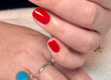 Vibrant red manicure by Kate Matthews Master Nail Artist at Weymouth, England, GB.