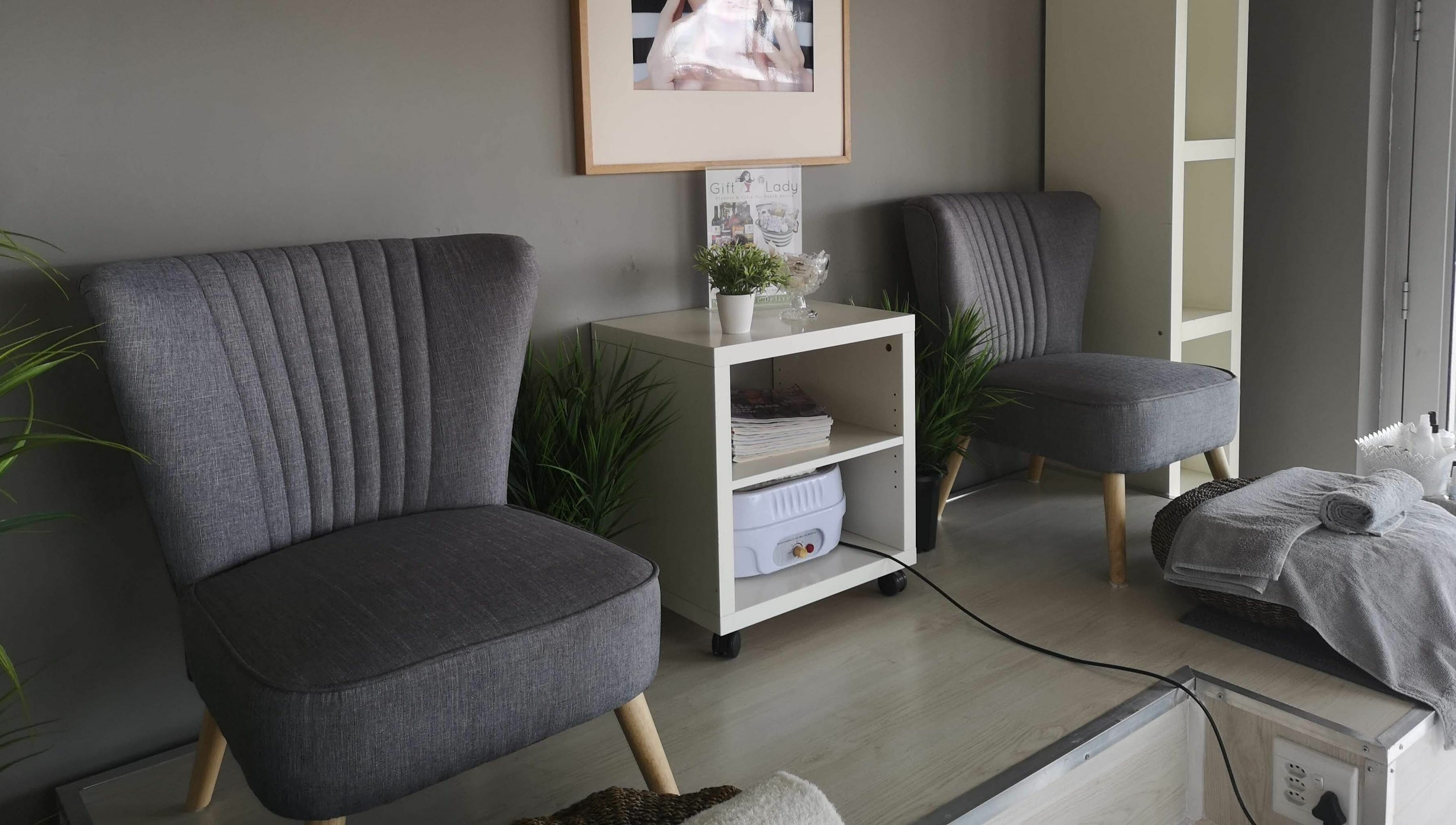 Relaxing lounge area at Beauty Bar, Port Elizabeth, Eastern Cape, ZA, featuring plush chairs and elegant decor.