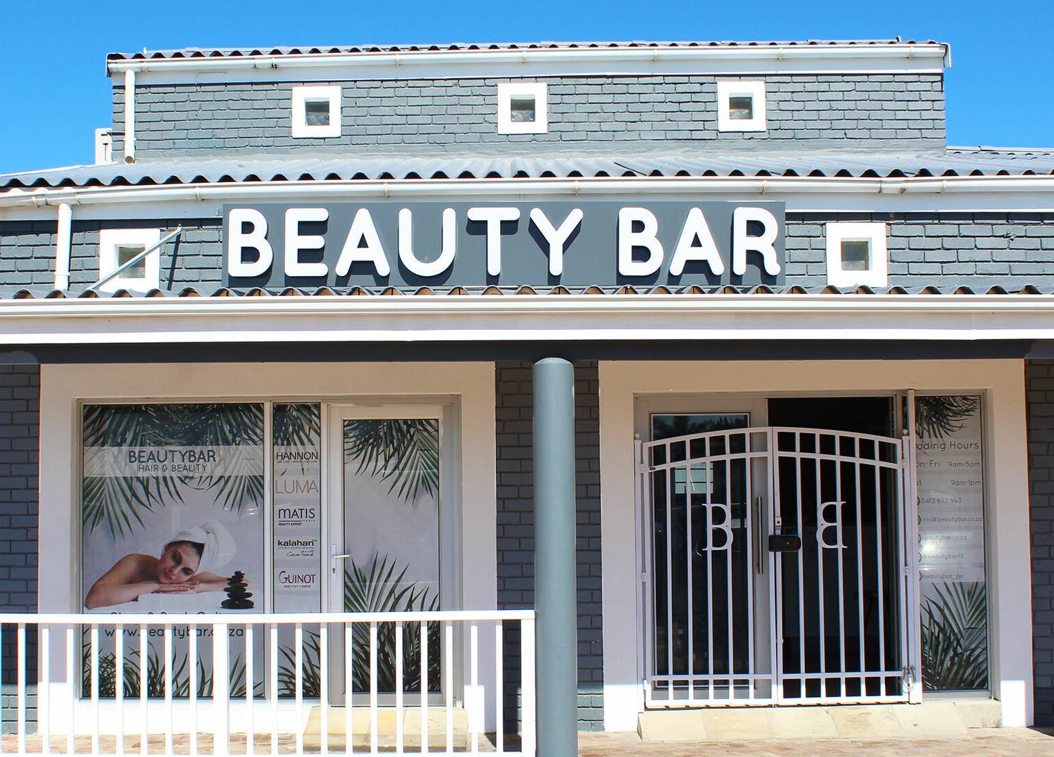 Front view of Beauty Bar in Port Elizabeth, Eastern Cape, ZA. Stylish brick building with prominent signage.
