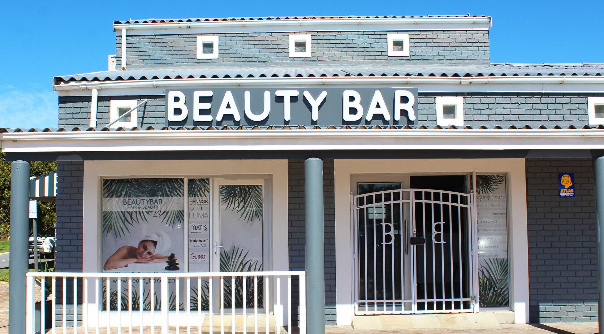 Front view of Beauty Bar in Port Elizabeth, Eastern Cape, ZA. Stylish brick building with prominent signage.