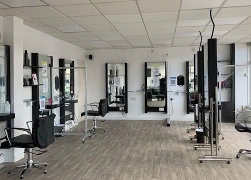 Elegant salon chairs and mirrors at Expressions in Birmingham, England, GB.