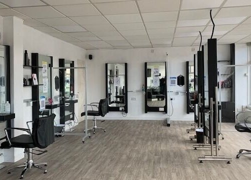 Elegant salon chairs and mirrors at Expressions in Birmingham, England, GB.