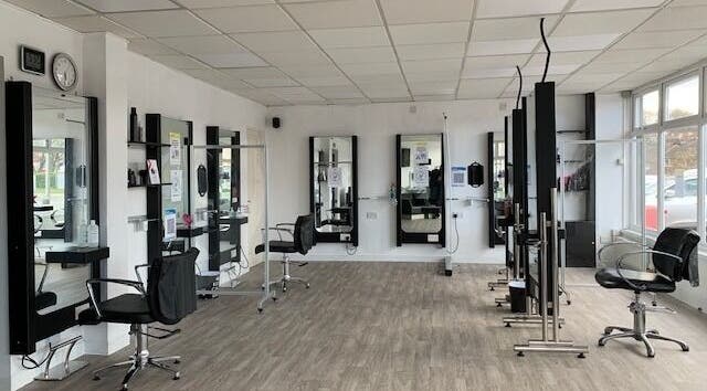 Elegant salon chairs and mirrors at Expressions in Birmingham, England, GB.