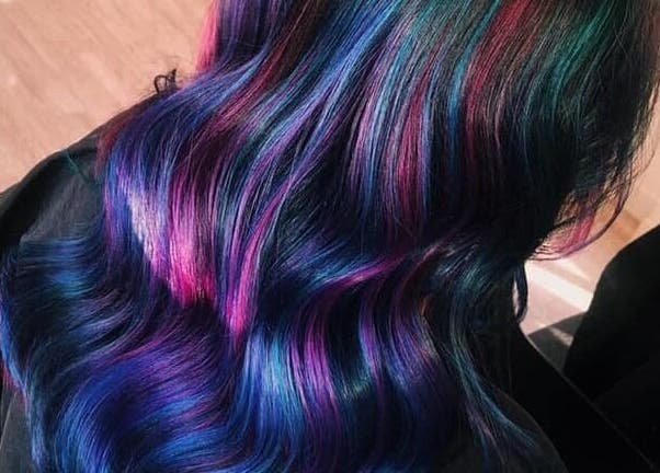 Vibrant multicolored hair styled at Expressions, Birmingham, England, GB for a radiant, unique look.