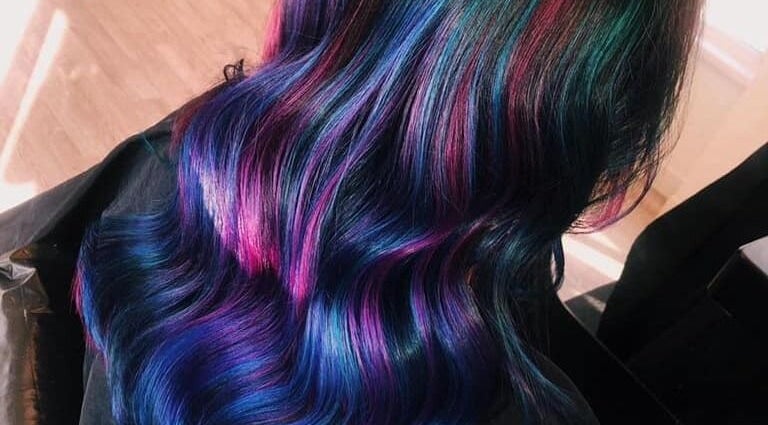 Vibrant multicolored hair styled at Expressions, Birmingham, England, GB for a radiant, unique look.