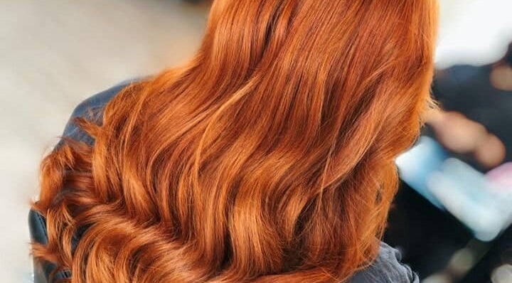 Lustrous copper hair waves styled at Expressions, Birmingham, England, GB salon.