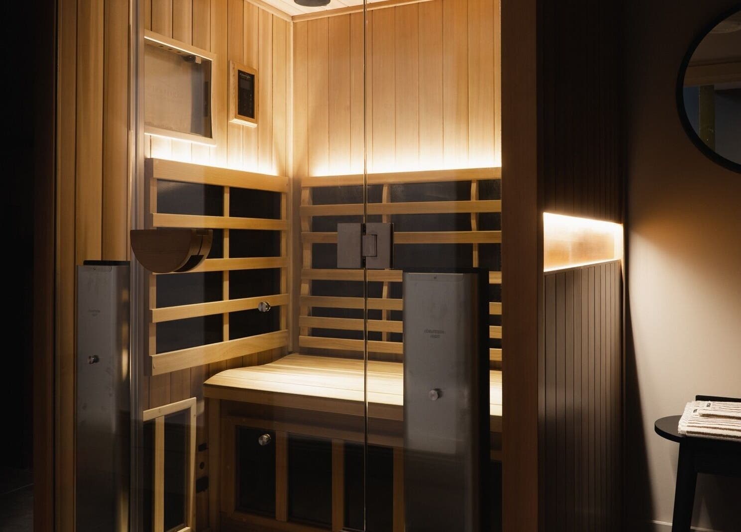 Warm wooden sauna room at Still London, located in London, England, GB, offering a serene relaxation space.