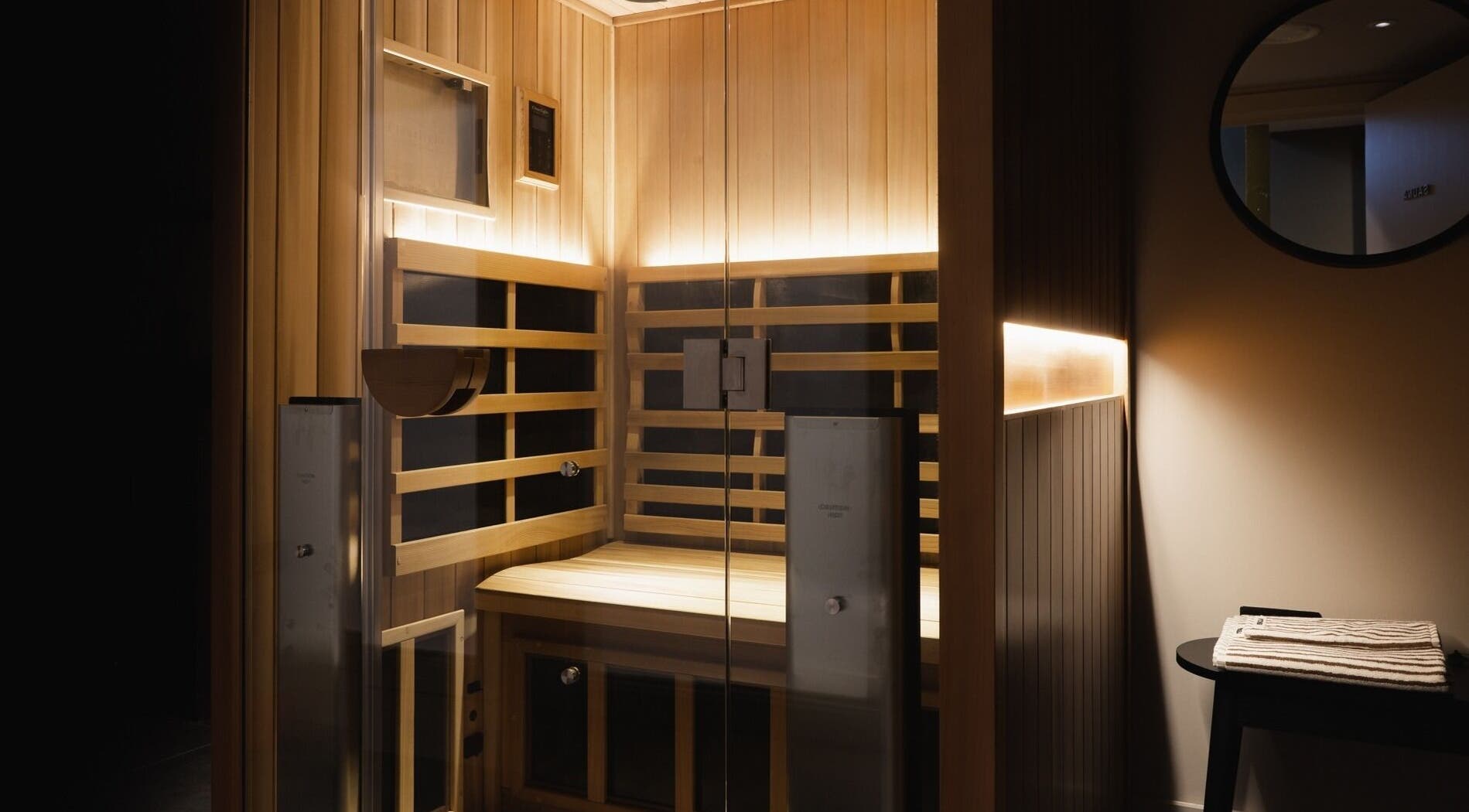 Warm wooden sauna room at Still London, located in London, England, GB, offering a serene relaxation space.