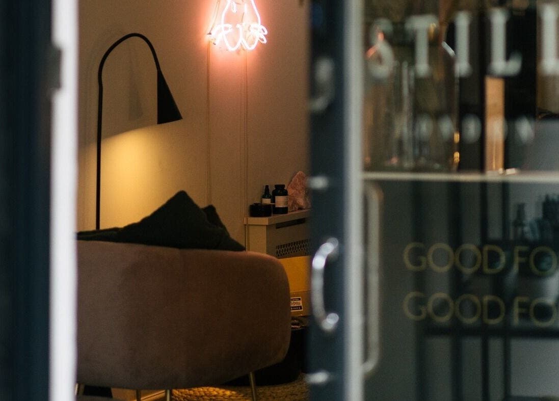 Serene interior view at Still London, London, England, GB showing a cozy seating area and ambient lighting.