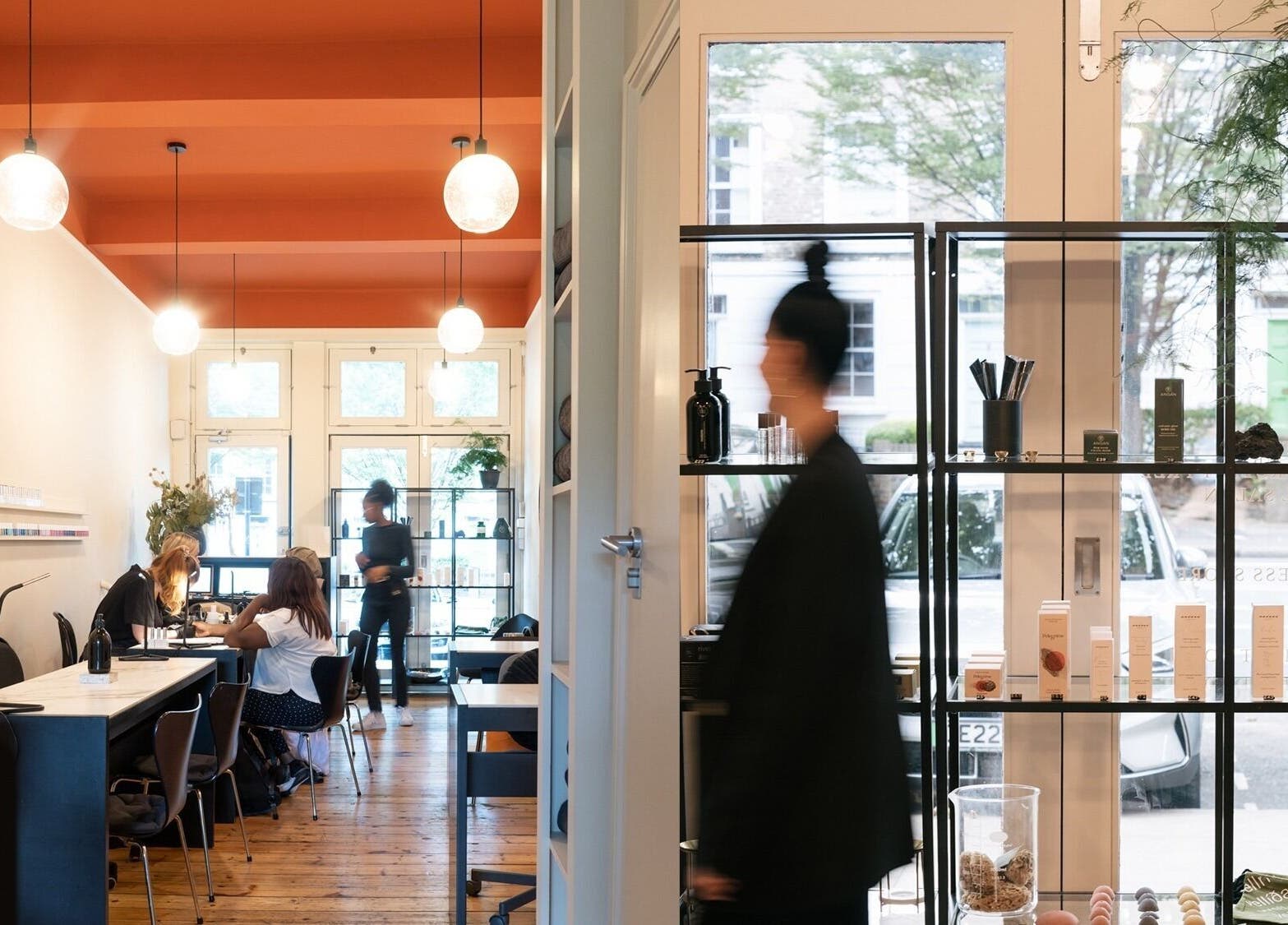 Inside Still London, a serene wellness space in London, England, GB with modern decor and customers being pampered.