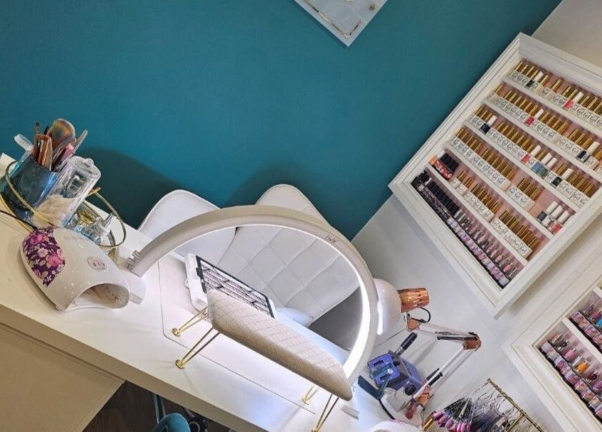 Perfect Touch Nail Bar in New Mills, England, GB features a modern design with a colorful polish display.