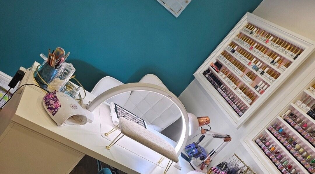 Perfect Touch Nail Bar in New Mills, England, GB features a modern design with a colorful polish display.