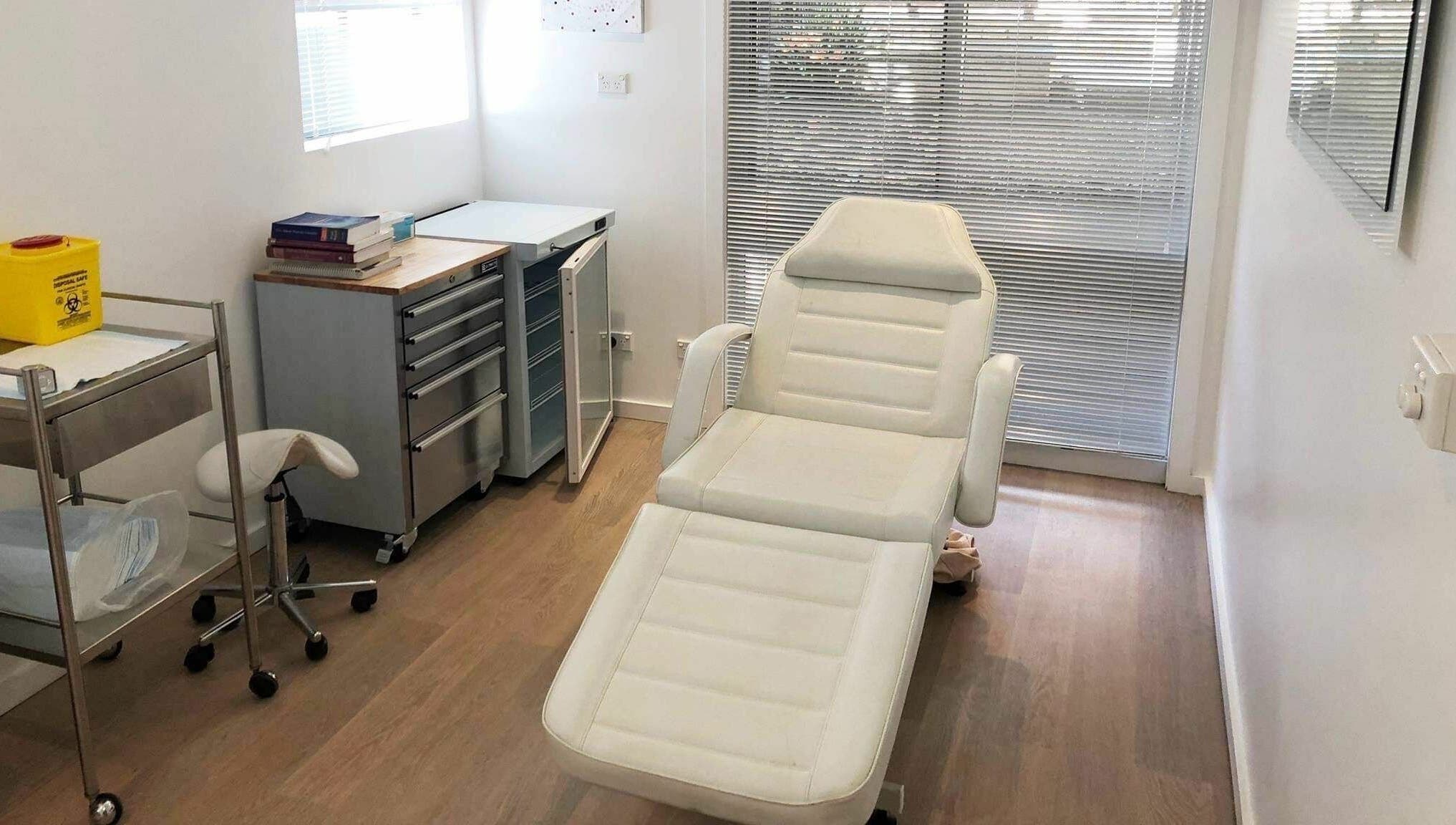 Modern treatment room at Shire Skin Renew, Miranda, New South Wales, AU, with reclining chair and medical decor.