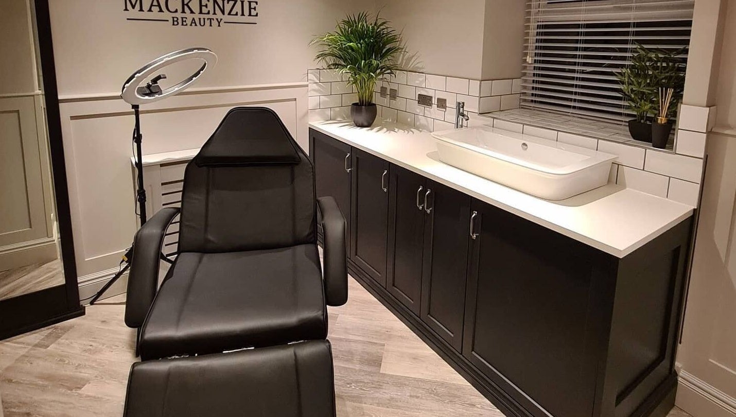 Modern beauty room at Tasha Mackenzie - BEAUTY, Conwy, Wales, GB with sleek styling chair and decor.