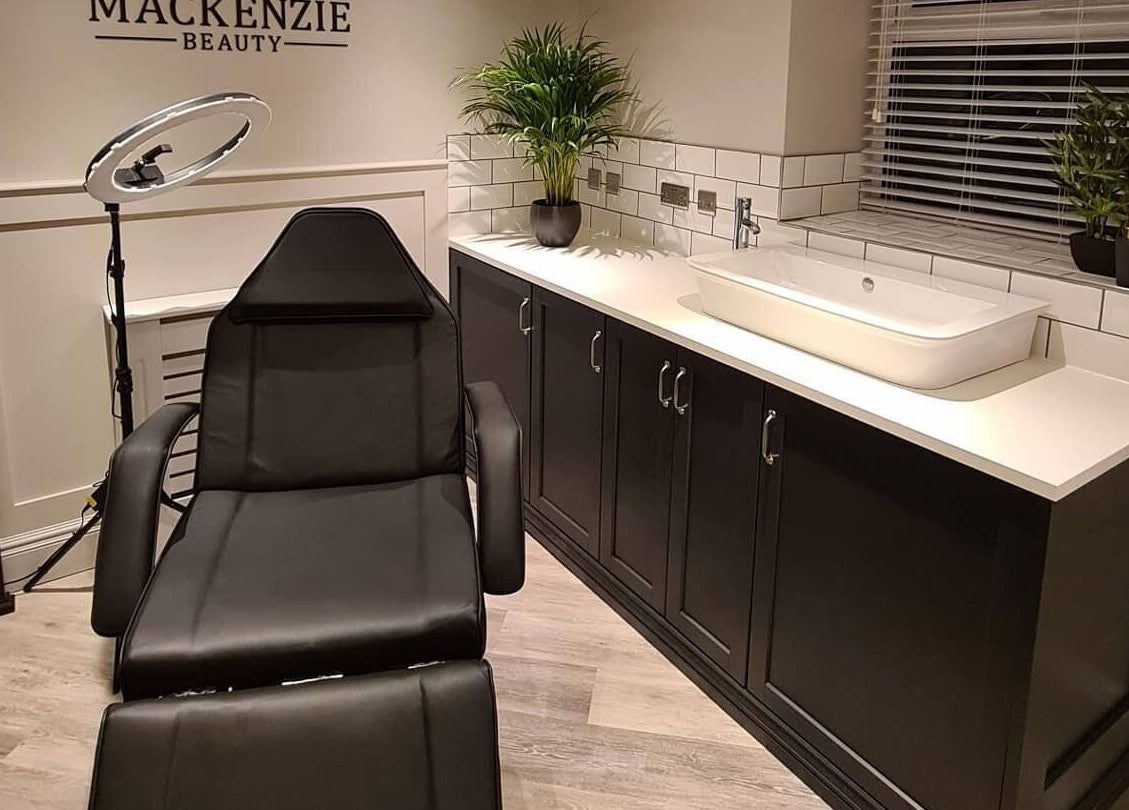 Modern beauty room at Tasha Mackenzie - BEAUTY, Conwy, Wales, GB with sleek styling chair and decor.