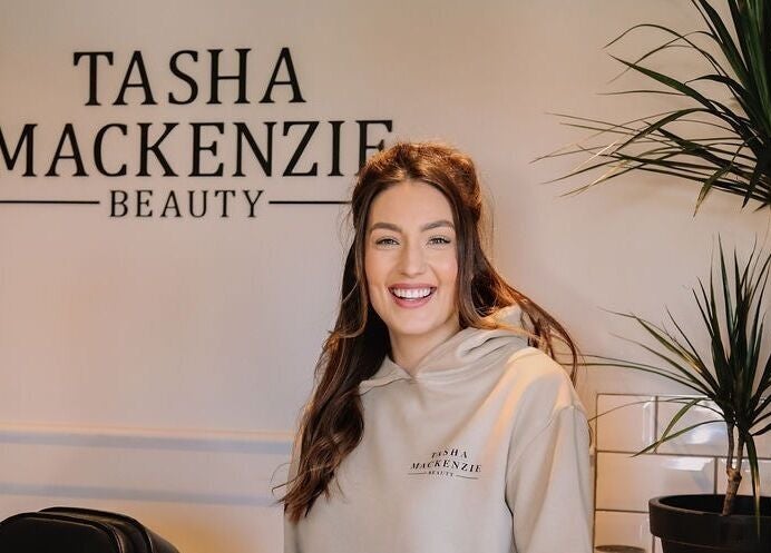 Smiling person at Tasha Mackenzie - BEAUTY, Conwy, Wales, GB, with stylish decor and serene ambiance.