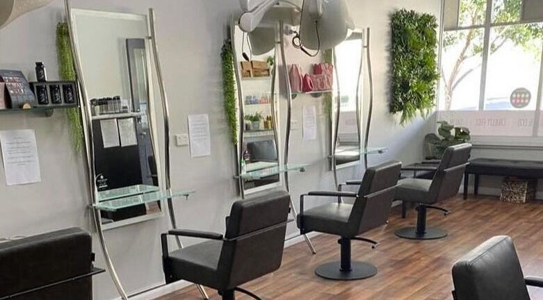 Modern salon chairs and mirrors at Hair on Hallett, Kadina, South Australia, AU with sleek interior design.