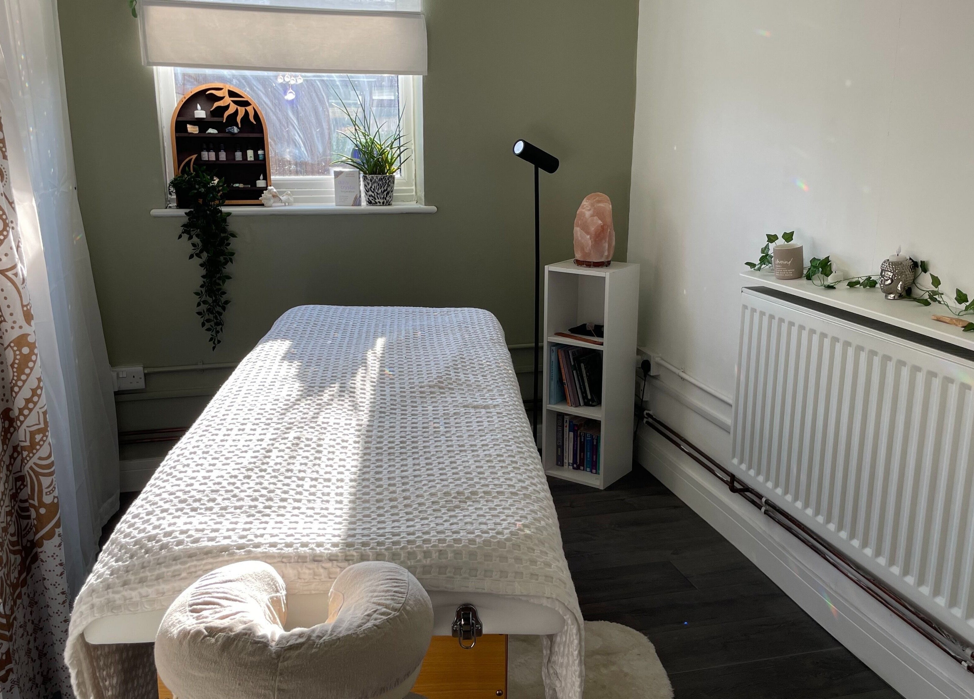 Serene treatment room at Mederi Wellness, Garsington, England, GB, with massage table and calming decor.