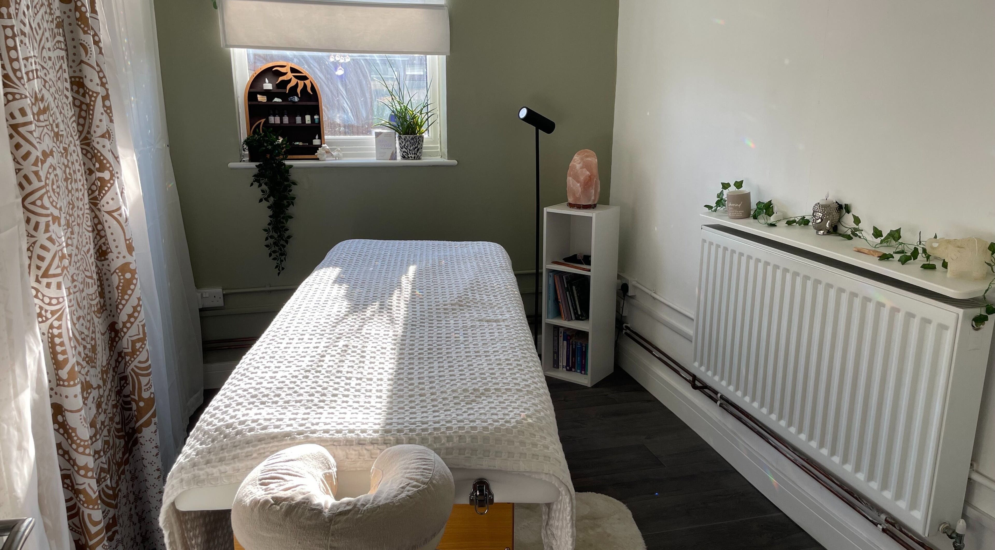 Serene treatment room at Mederi Wellness, Garsington, England, GB, with massage table and calming decor.