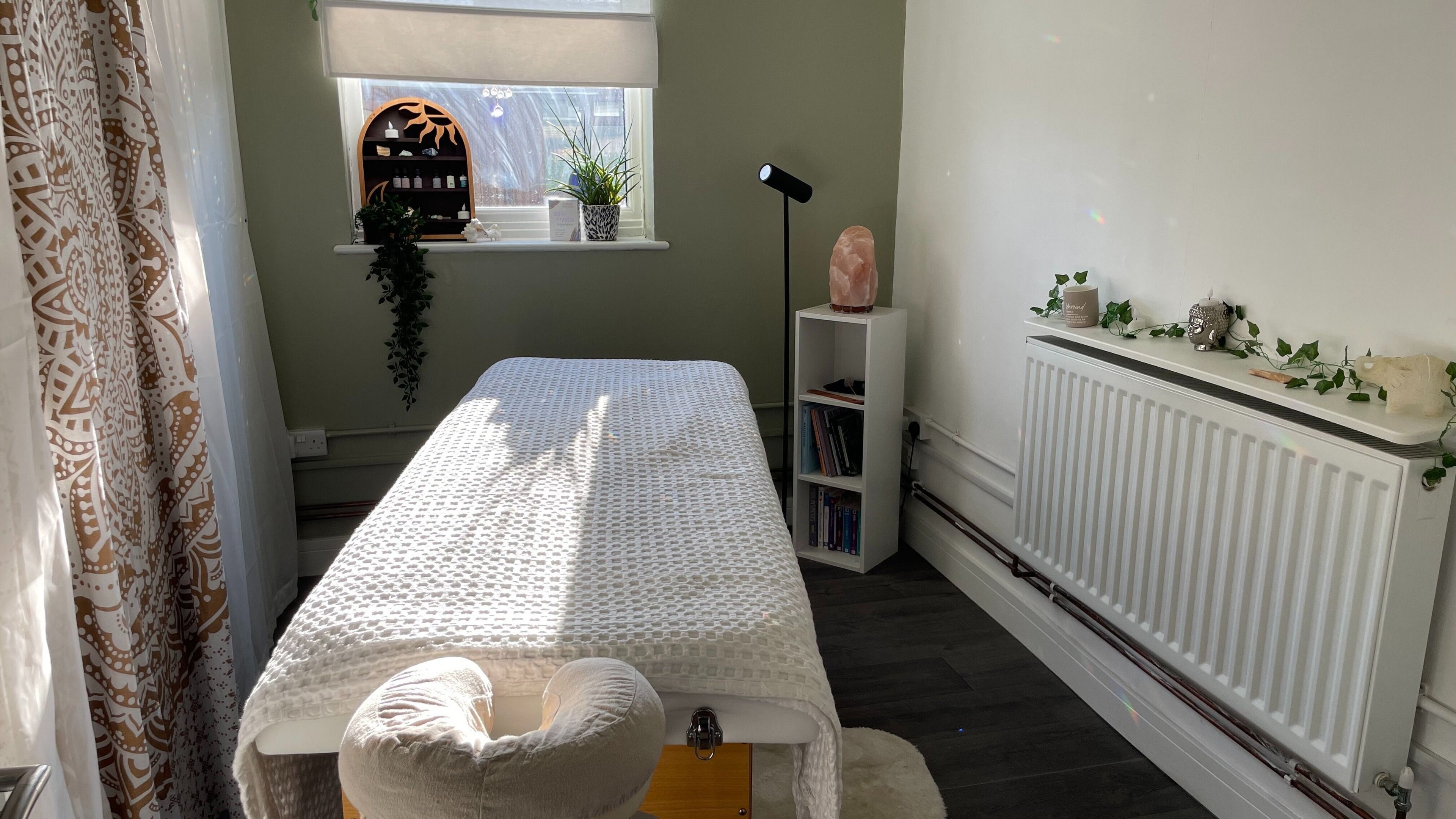 Serene treatment room at Mederi Wellness, Garsington, England, GB, with massage table and calming decor.