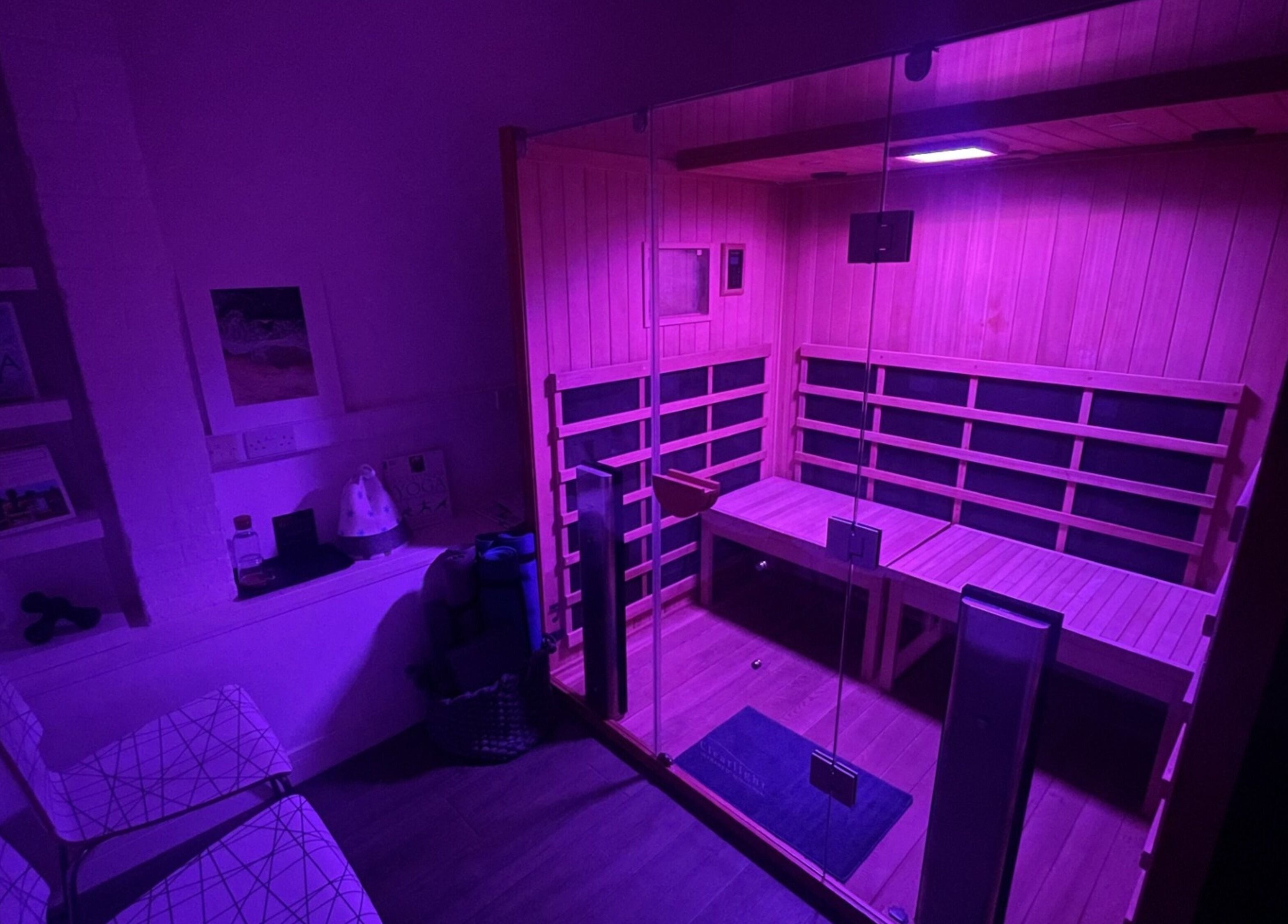 Luxurious purple-lit sauna at Mederi Wellness, Garsington, England, GB for relaxation and rejuvenation.