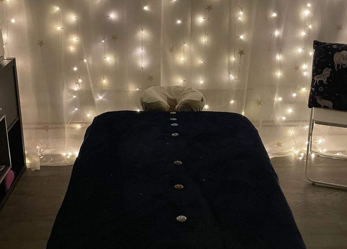 Cozy massage room at Mederi Wellness with ambient lighting in Garsington, England, GB.
