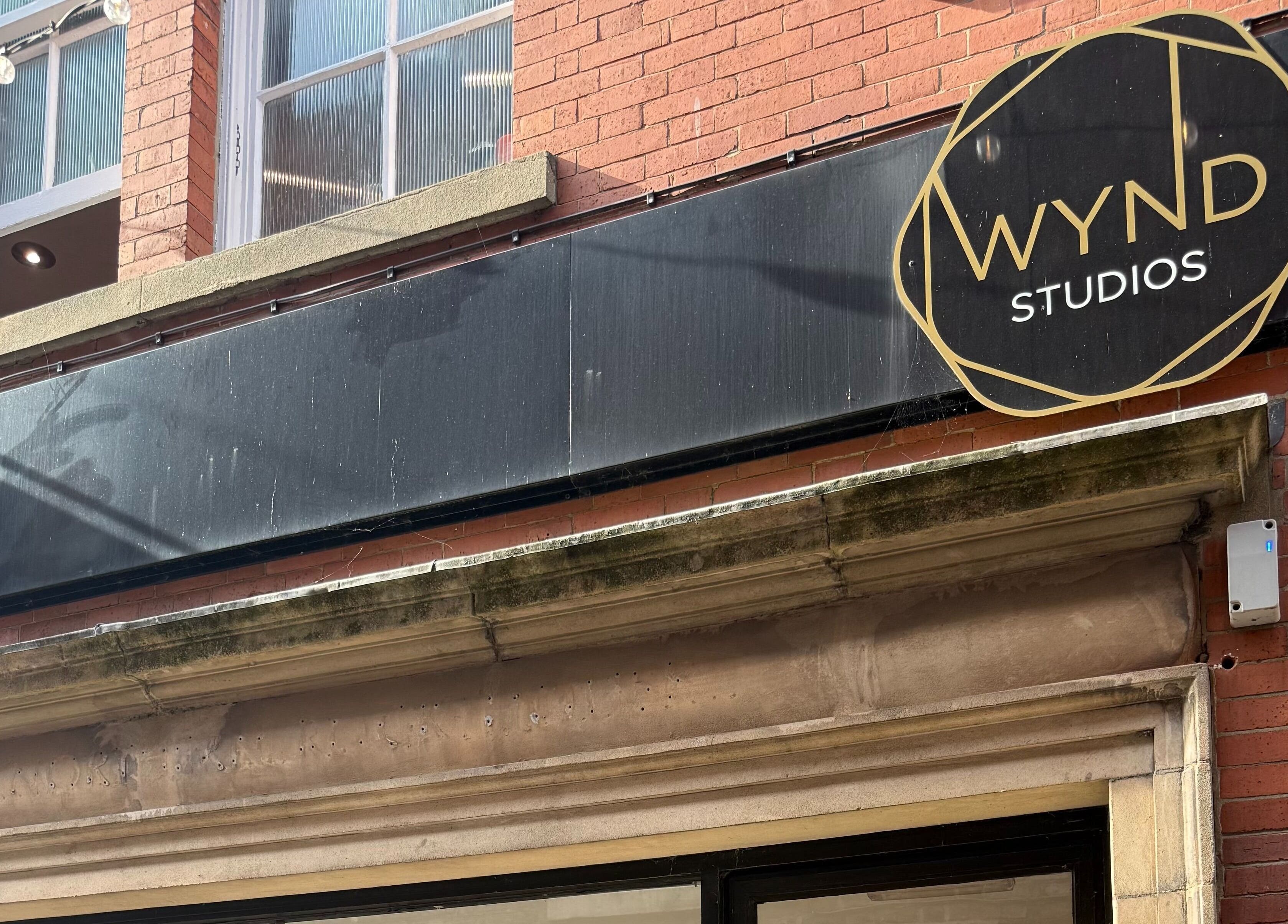 Elegant facade at The Piercing Lady, Darlington, England, GB showcasing sleek signage.