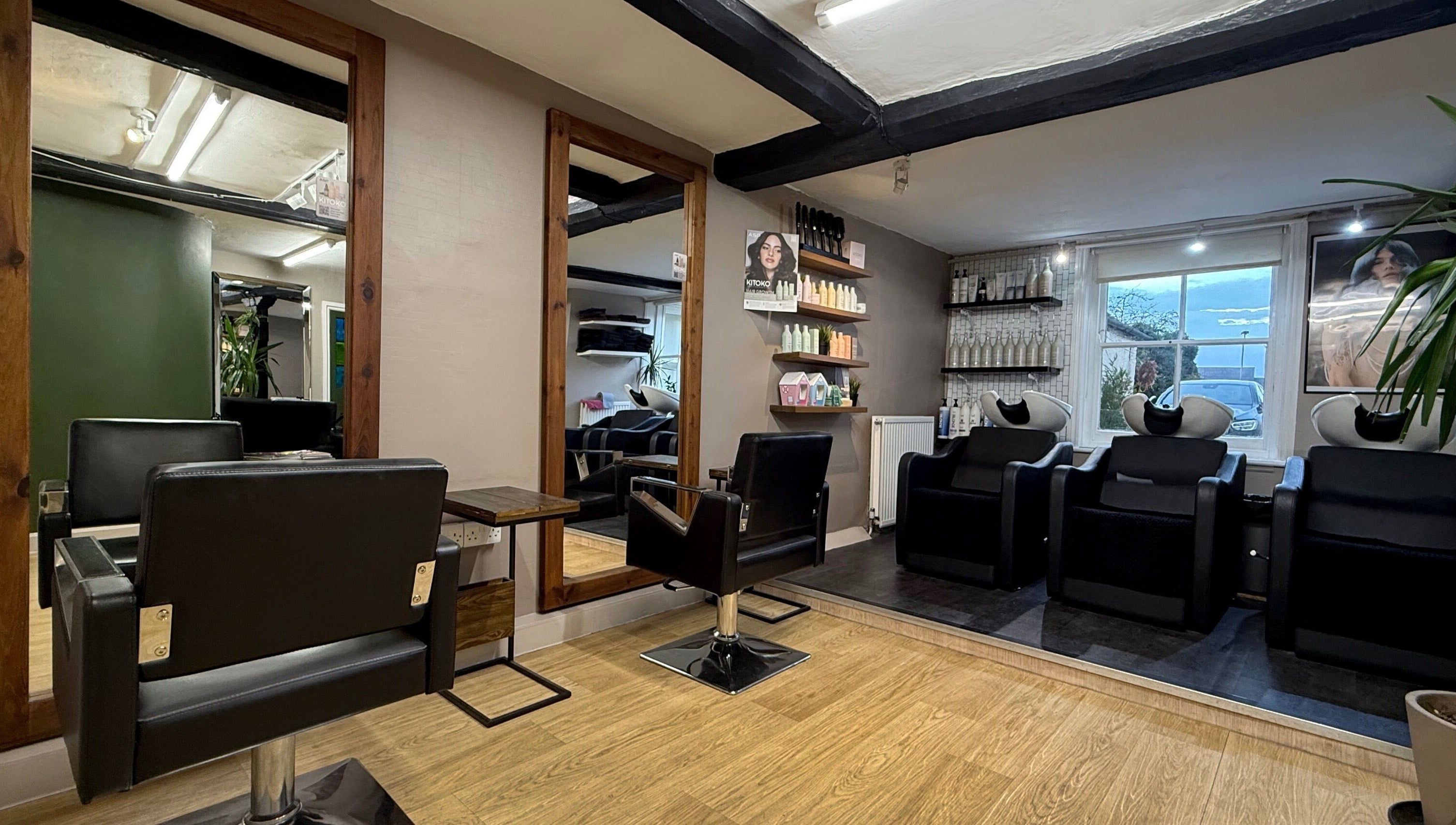 Let Lew Hair Design - Evesham showcases modern salon chairs and cozy ambiance in Evesham, England, GB.