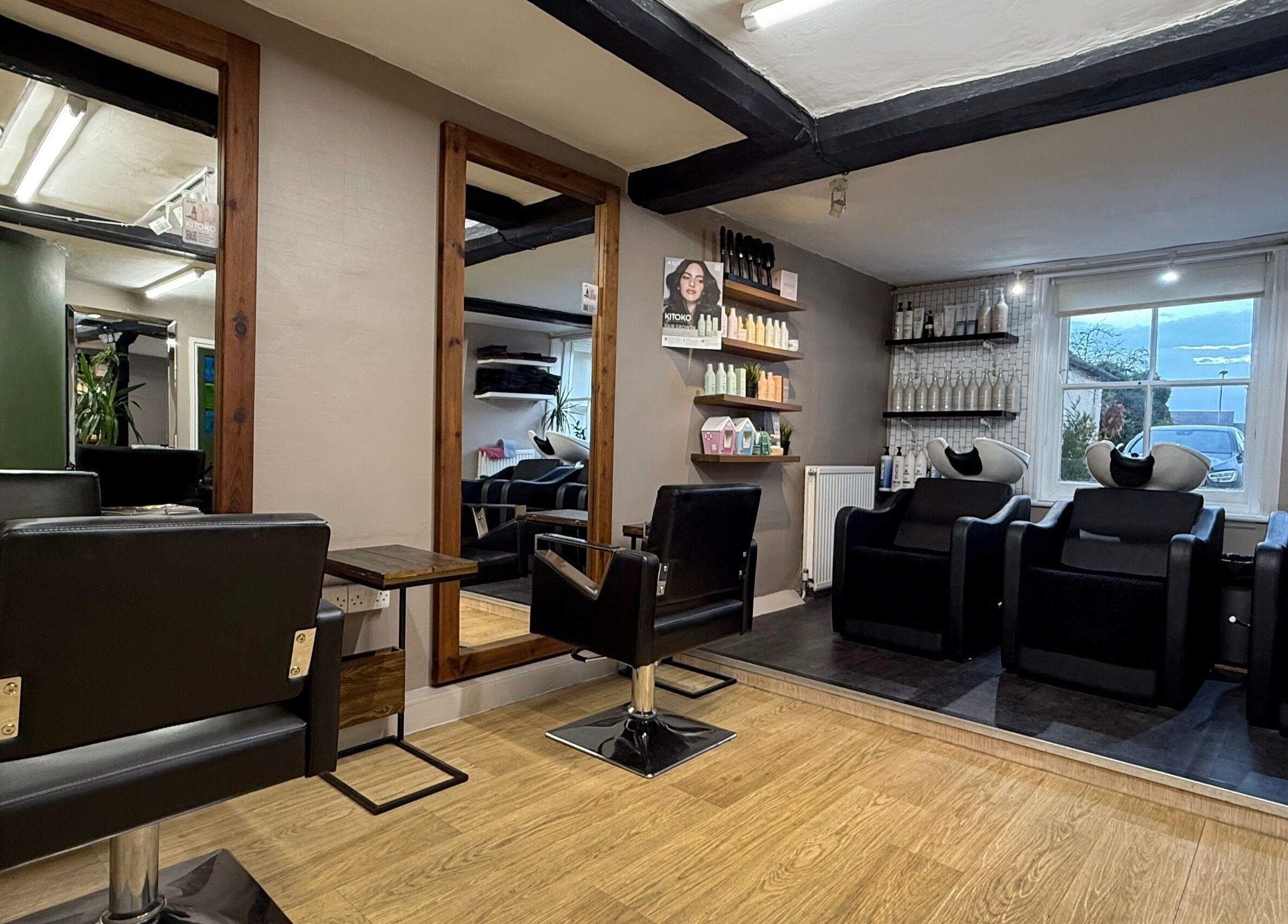 Let Lew Hair Design - Evesham showcases modern salon chairs and cozy ambiance in Evesham, England, GB.
