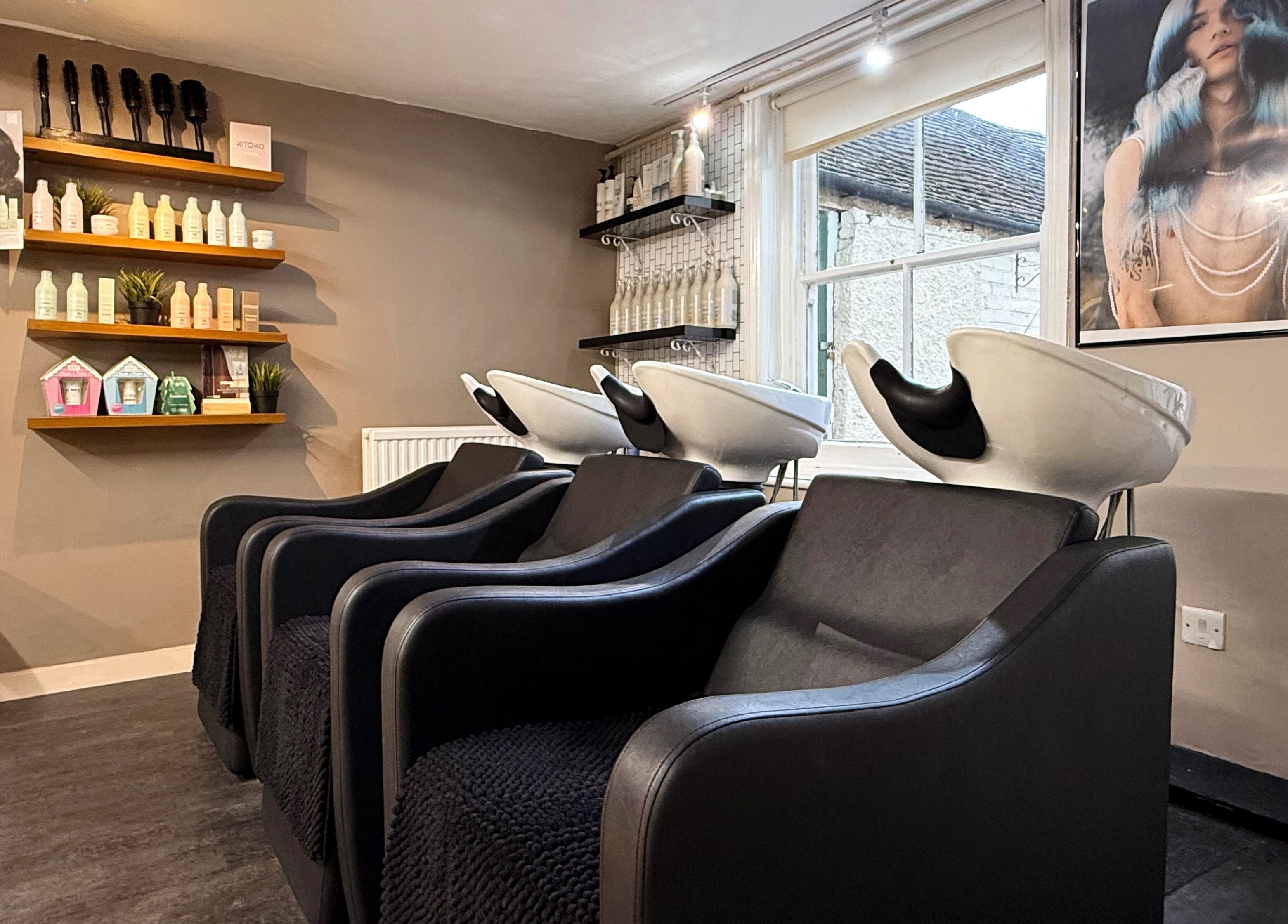 Modern salon wash station at Let Lew Hair Design - Evesham, Evesham, England, GB, showcasing sleek chairs.