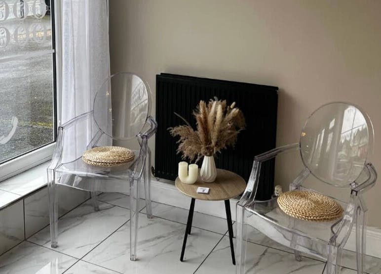 Relaxing seating area with clear chairs and decor at Studio Glow, Huddersfield, England, GB.