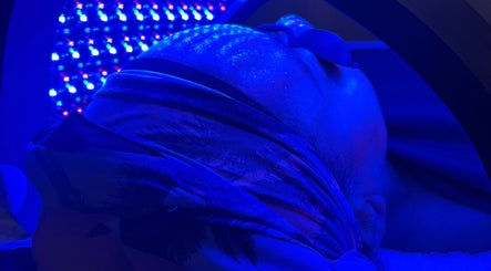 LED facial treatment at Bronx Moon Esthetics in Bronx, New York, US, enhancing skin with blue light therapy.
