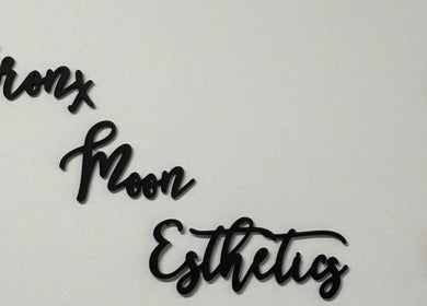 Bronx Moon Esthetics sign with moon phases decoration in Bronx, New York, US.