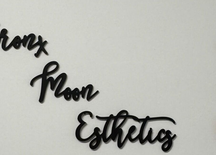 Bronx Moon Esthetics sign with moon phases decoration in Bronx, New York, US.