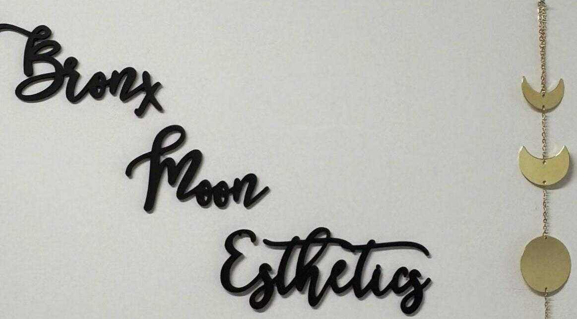 Bronx Moon Esthetics sign with moon phases decoration in Bronx, New York, US.