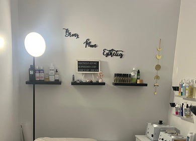 Cozy skincare corner at Bronx Moon Esthetics in Bronx, New York, US with soft lighting and beauty products.
