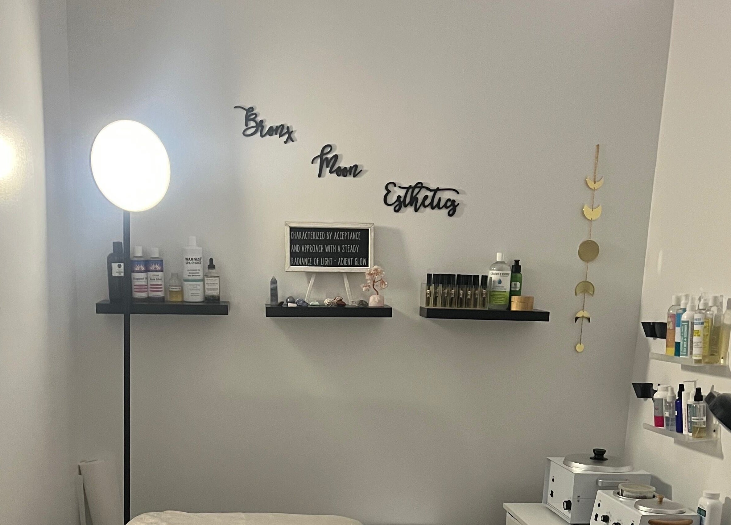 Cozy skincare corner at Bronx Moon Esthetics in Bronx, New York, US with soft lighting and beauty products.