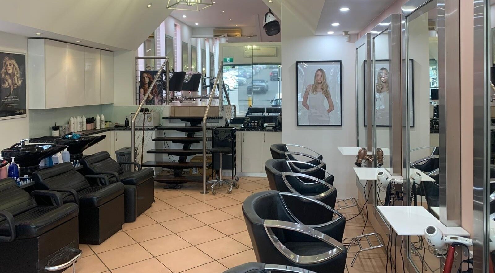 Modern interior of The Edge Hair Salon in Wahroonga, New South Wales, AU with sleek chairs and mirrors.