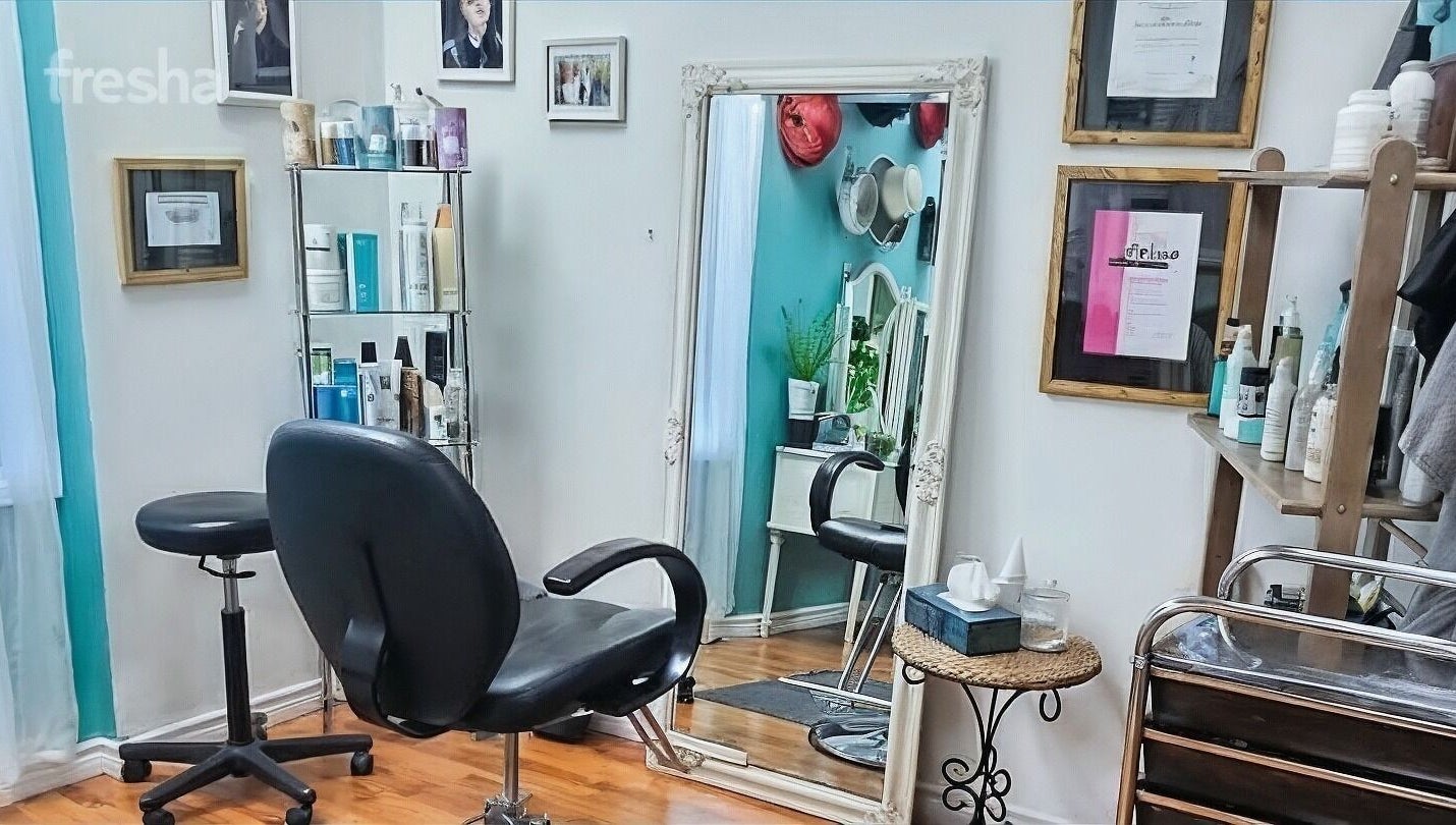 Stylish salon interior at Inspirado Designs, Kelowna, British Columbia, CA, showcasing elegant mirrors and chairs.