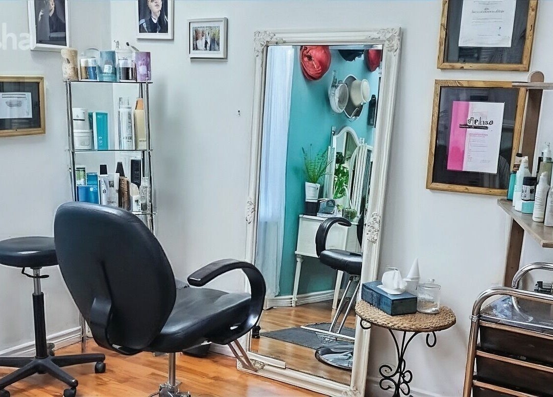 Stylish salon interior at Inspirado Designs, Kelowna, British Columbia, CA, showcasing elegant mirrors and chairs.