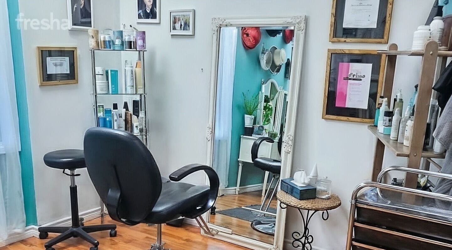 Stylish salon interior at Inspirado Designs, Kelowna, British Columbia, CA, showcasing elegant mirrors and chairs.