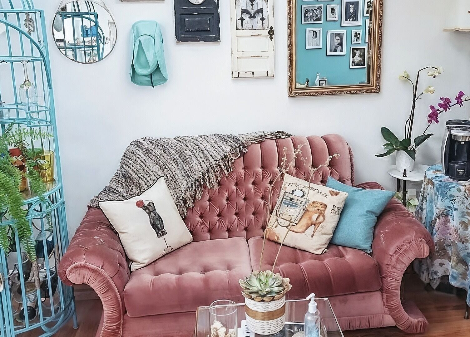 Chic vintage-style room with pink velvet sofa at Inspirado Designs, Kelowna, British Columbia, CA.