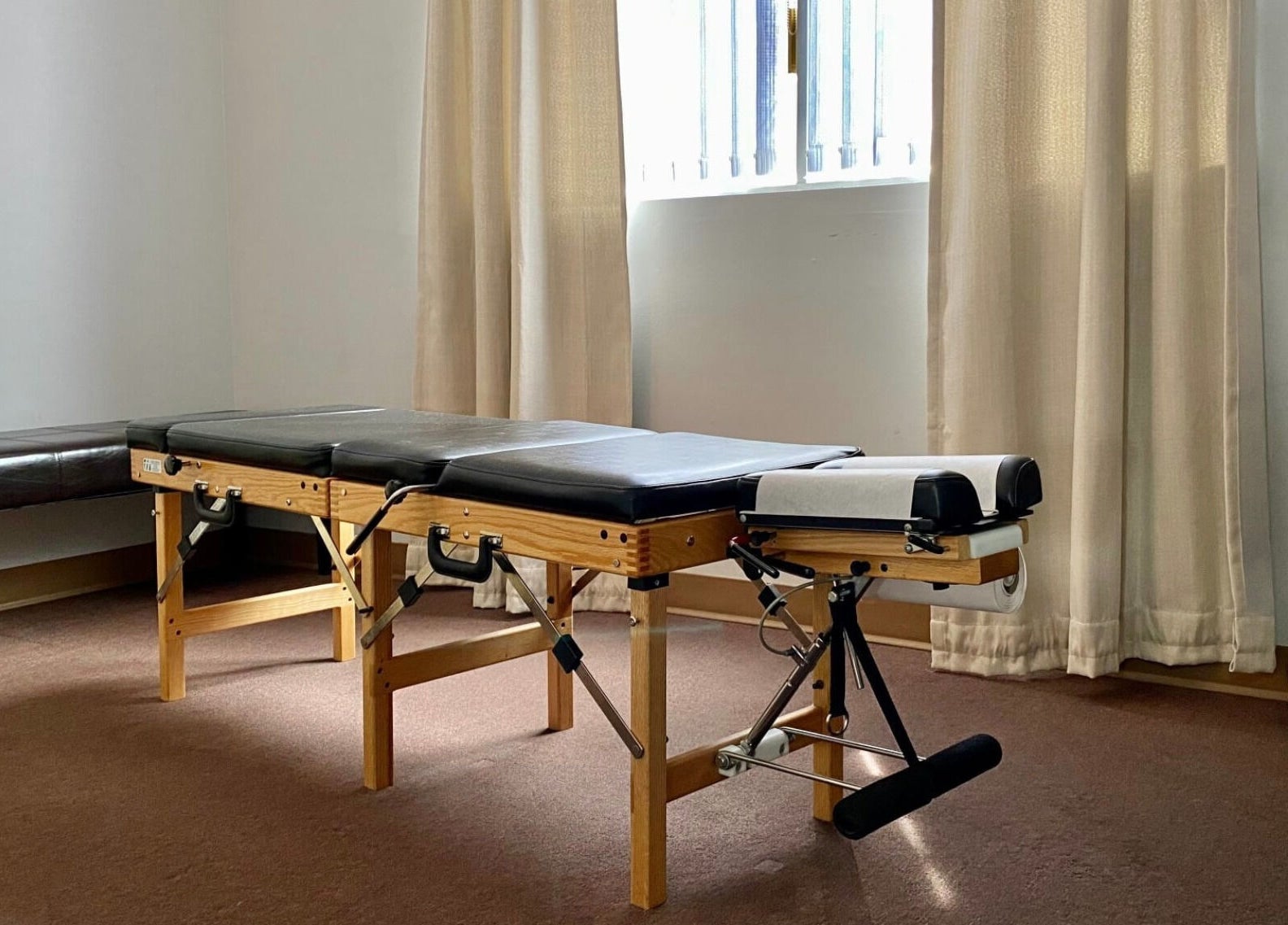 Massage therapy room at Bluebell Health, Winnipeg, Manitoba, CA with treatment table and natural light.